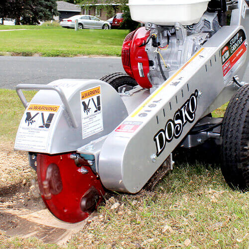 Operator using a Dosko Brush Chipper