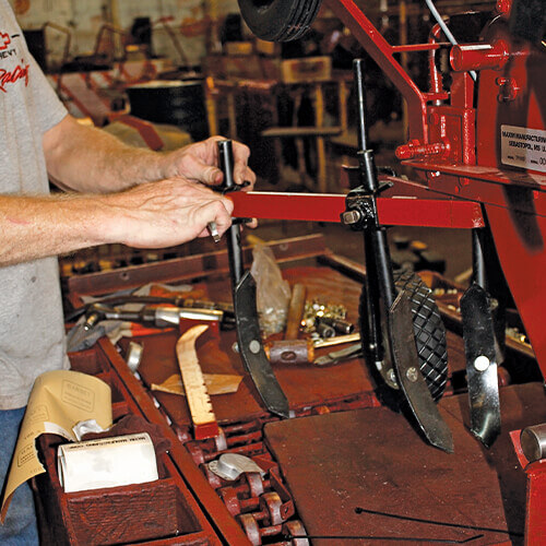 Mechanic working on a tiller