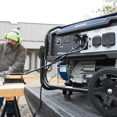 Homeowner using a Powerhorse Generator